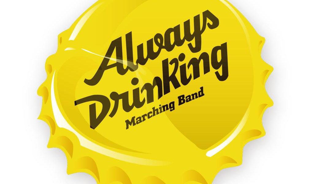 A yellow bottle cap with the text Always Drinking Marching Band written in bold, stylised black letters across the centre.